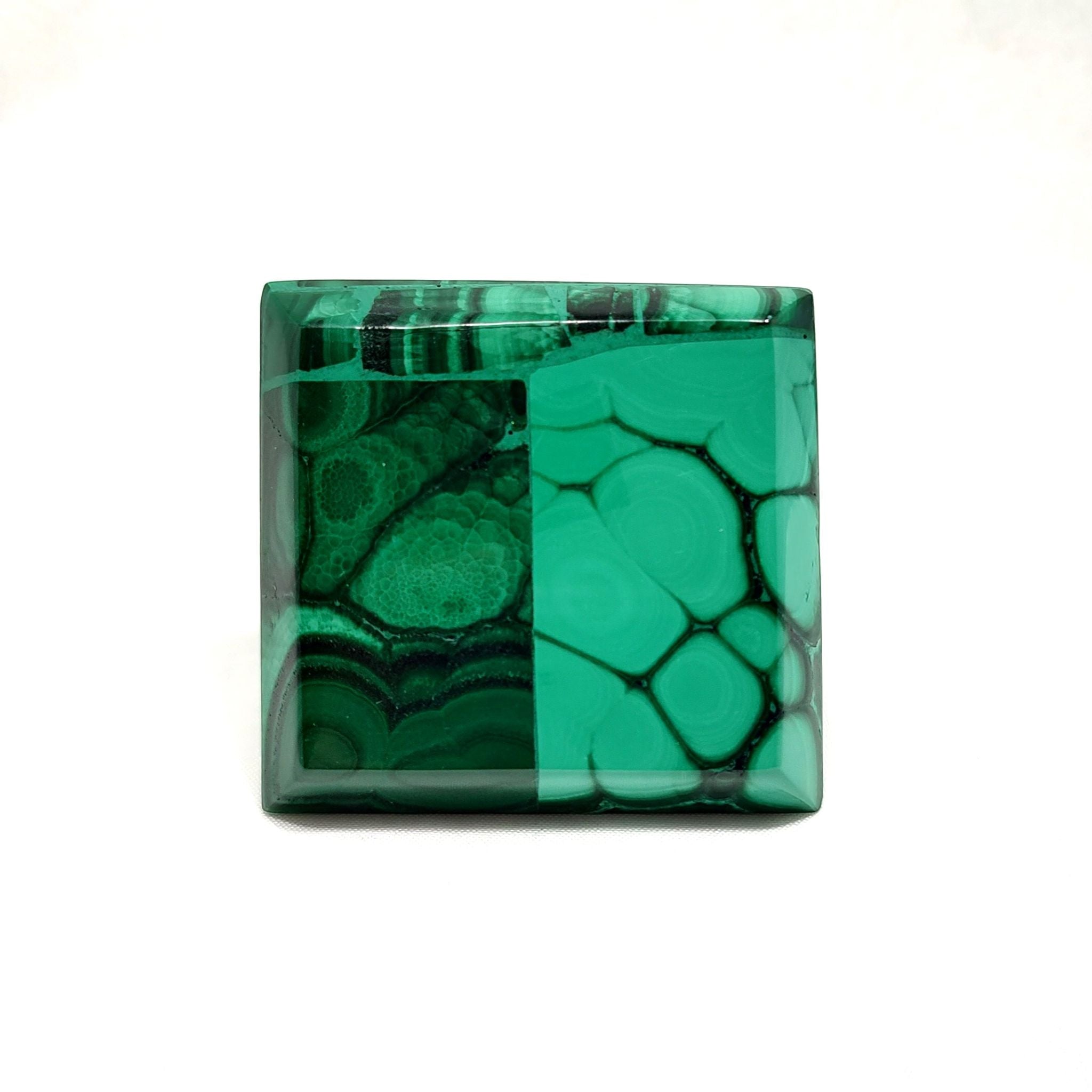 Bottom view of a handcrafted pyramid, made with malachite.