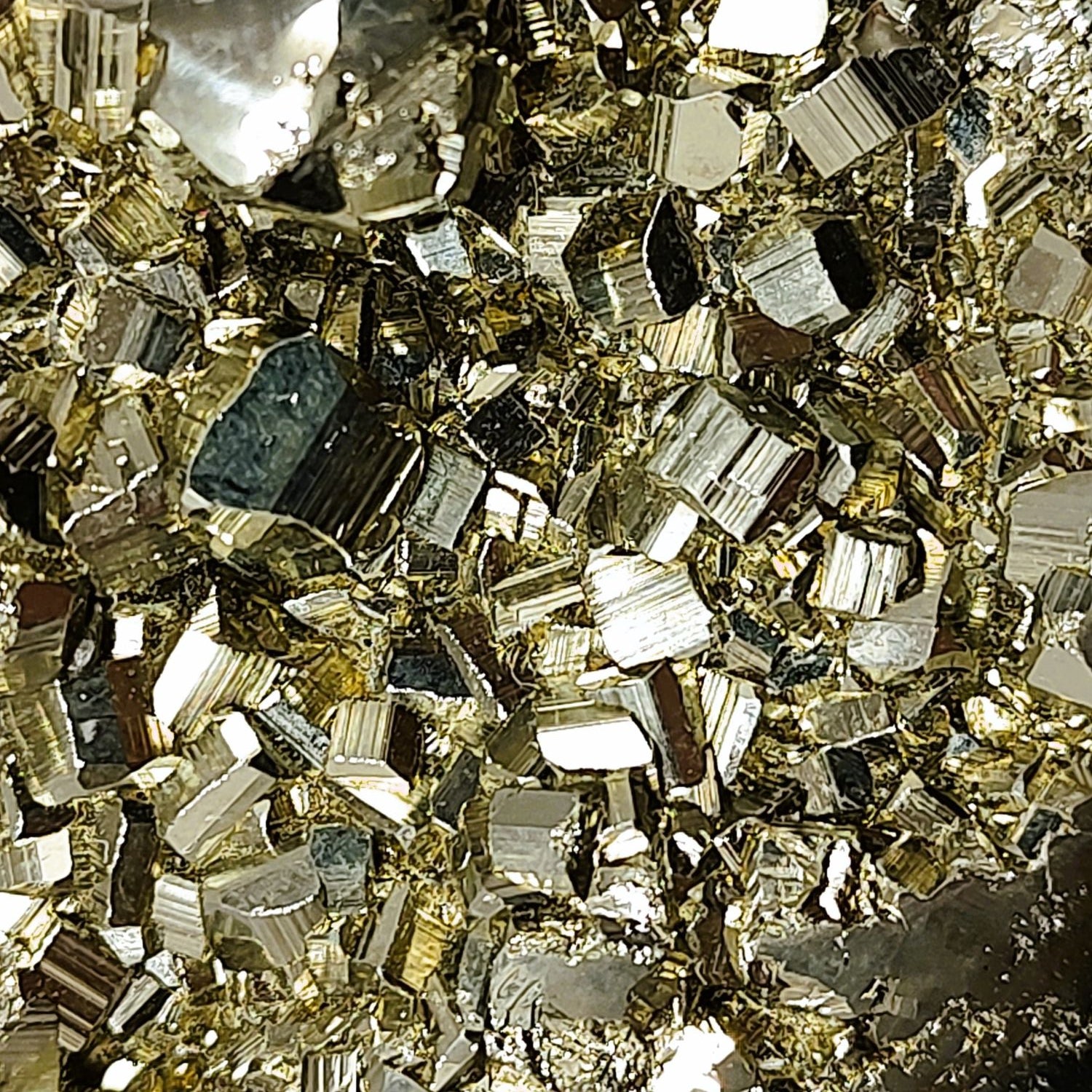 Close-up of golden metallic pyrite crystals.